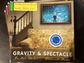 Gravity & Spectacle - By Jia Oak Baker & Shawnte Orion